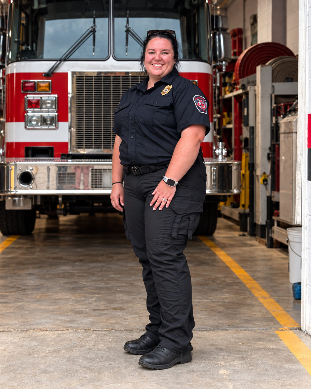 A firefighter wearing MGT pants in her fire station